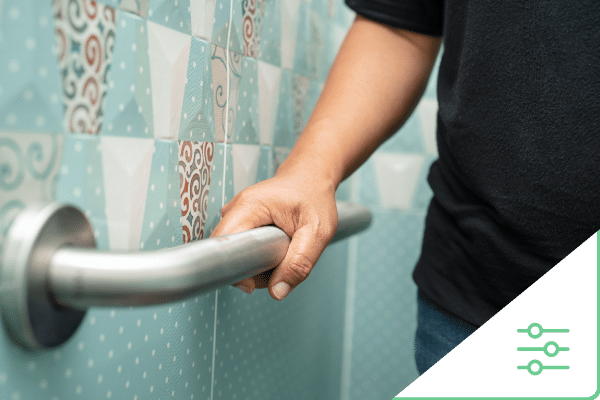 Man holding grab bar