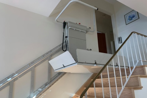 Mobility lift at the top of residential stairwell